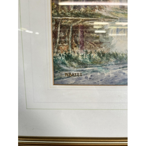 235 - A framed W. Bates watercolour of a lake and town scene - approx. 46cm high x 56cm wide