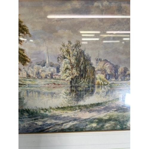 235 - A framed W. Bates watercolour of a lake and town scene - approx. 46cm high x 56cm wide