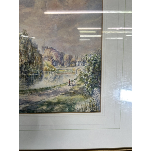 235 - A framed W. Bates watercolour of a lake and town scene - approx. 46cm high x 56cm wide