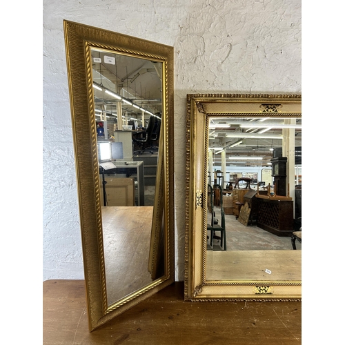 238 - Two gilt framed wall mirrors - largest approx. 88cm high x 66cm wide