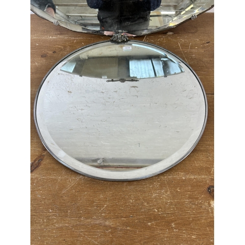 254 - Two mid 20th century bevelled edge wall hanging mirrors - largest approx. 44cm high x 69cm wide