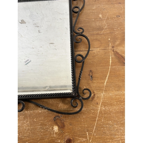 255 - A modern wrought iron framed bevelled edge wall mirror - approx. 60cm high x 49cm wide