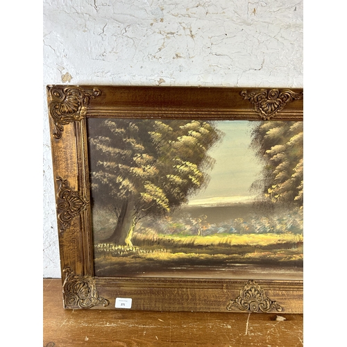 271 - A gilt framed oil on canvas of a woodland scene, signed lower right - approx. 51cm high x 90cm wide