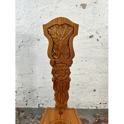 28 - A carved pine spinning chair - approx. 91cm high