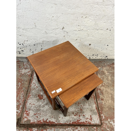 29 - A mid 20th century teak nest of tables - approx. 40cm high x 44cm square