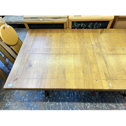 30 - A modern solid oak and wrought rectangular dining table - approx. 76cm high x 98cm wide x 181cm long