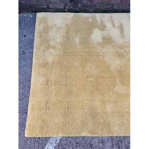 31 - A John Lewis Yellow Dream 100% wool rug - approx. 240cm x 170cm