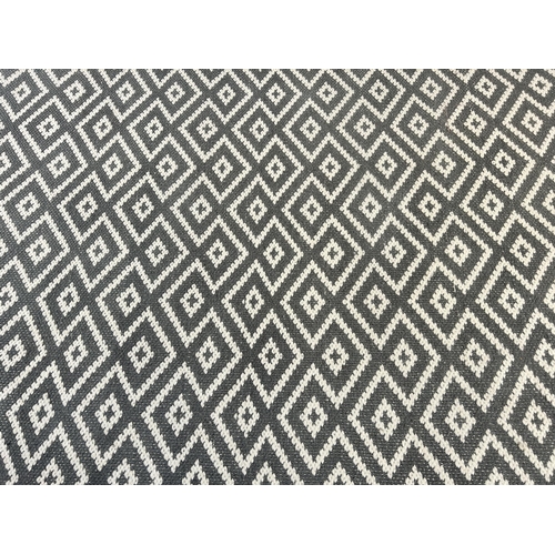 32 - A Next grey wool and cotton rug - approx. 200cm x 140cm