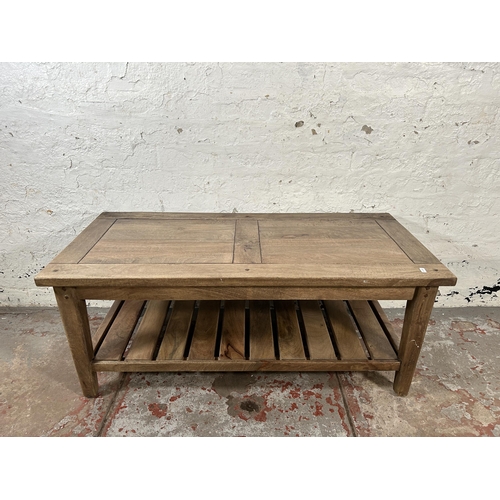 4 - A mango wood rectangular two tier coffee table - approx. 46cm high x 52cm wide x 110cm long