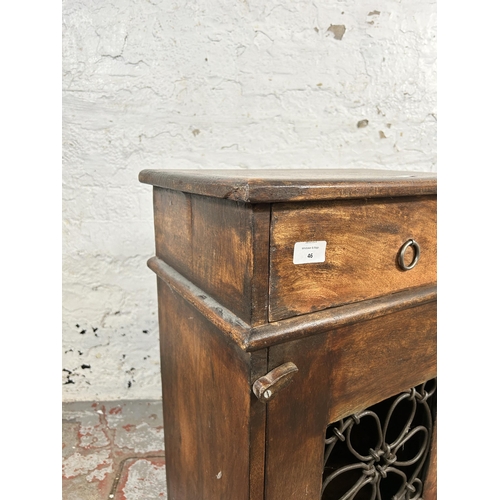 46 - An Indian hardwood and wrought metal bedside cabinet