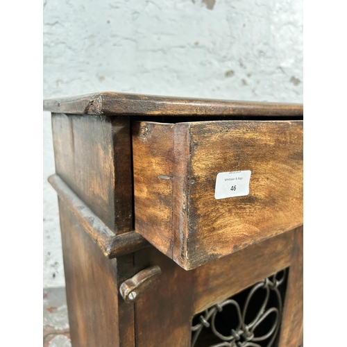 46 - An Indian hardwood and wrought metal bedside cabinet