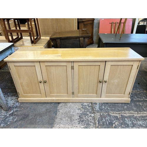 50 - A modern beech four door sideboard