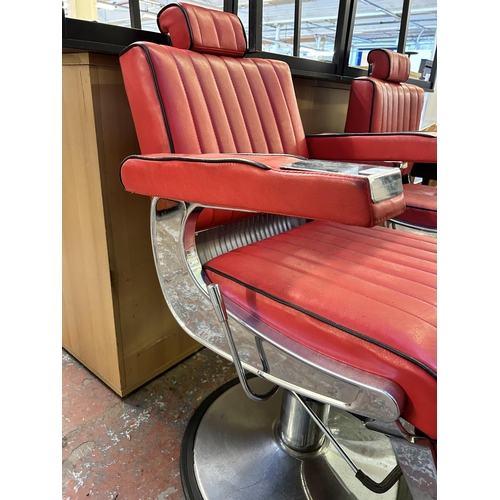 55 - A red leatherette and chrome plated adjustable swivel barber's chair