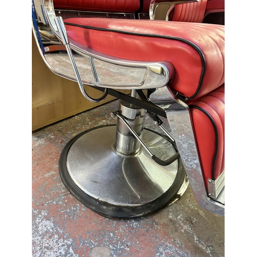 55 - A red leatherette and chrome plated adjustable swivel barber's chair