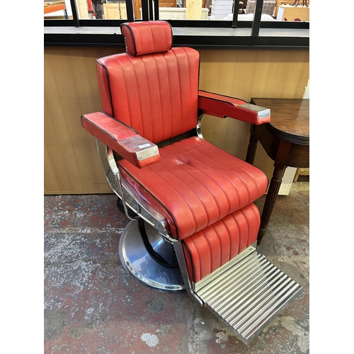 56 - A red leatherette and chrome plated adjustable swivel barber's chair