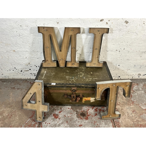 62 - Five items, one early 20th century green travel trunk and four industrial style galvanised and woode... 