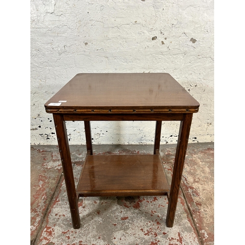 64 - A mid 20th century carved oak two tier side table