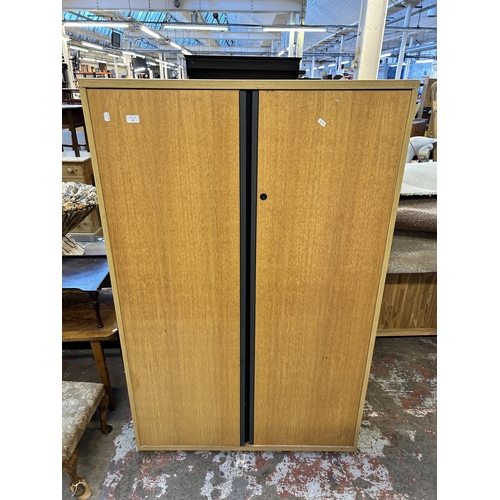 67 - A modern oak effect two door office cabinet