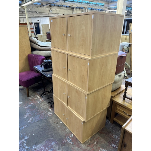 70 - Four modern beech effect two door cabinets