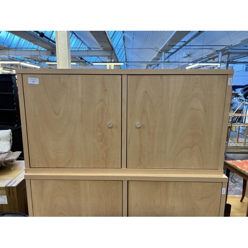 70 - Four modern beech effect two door cabinets