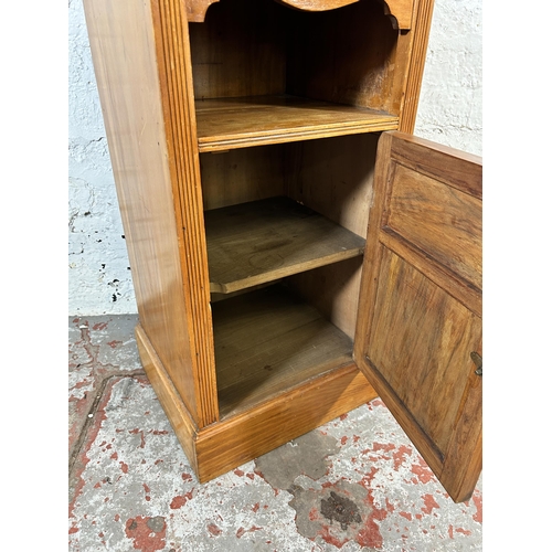 71 - An Edwardian satinwood and burr walnut bedside cabinet