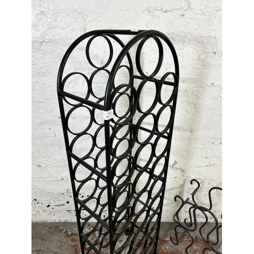 72 - Two modern wrought metal bottle racks - largest approx. 109cm high x 32cm wide