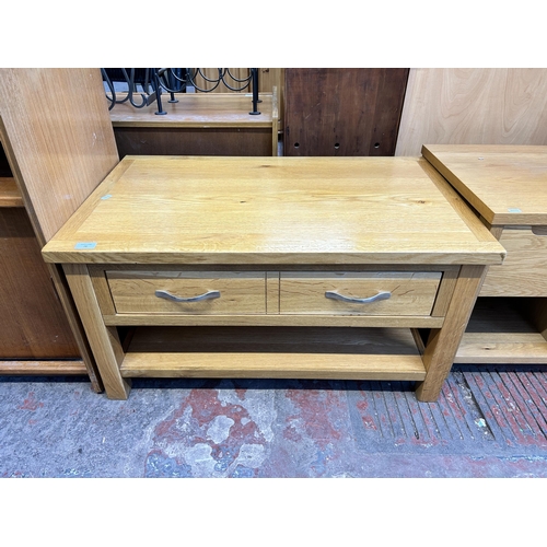 79 - A modern oak rectangular two tier coffee table - approx. 47cm high x 55cm wide x 90cm long