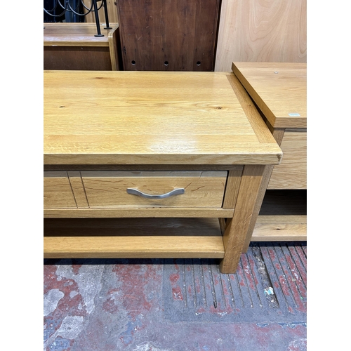 79 - A modern oak rectangular two tier coffee table - approx. 47cm high x 55cm wide x 90cm long