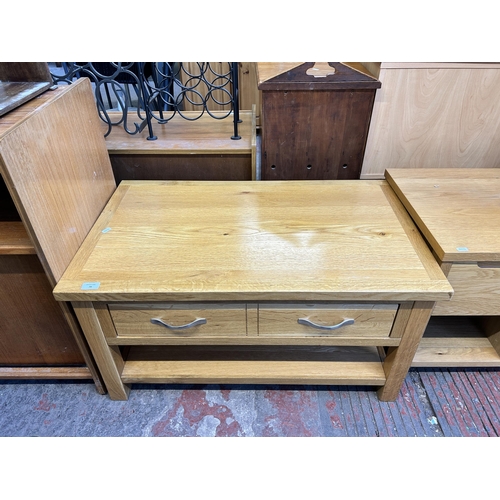 79 - A modern oak rectangular two tier coffee table - approx. 47cm high x 55cm wide x 90cm long