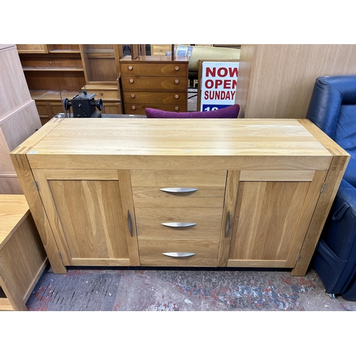 83 - A modern oak sideboard - approx. 86cm high x 160cm wide x 50cm deep