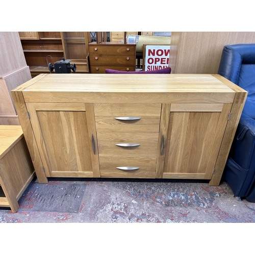 83 - A modern oak sideboard - approx. 86cm high x 160cm wide x 50cm deep