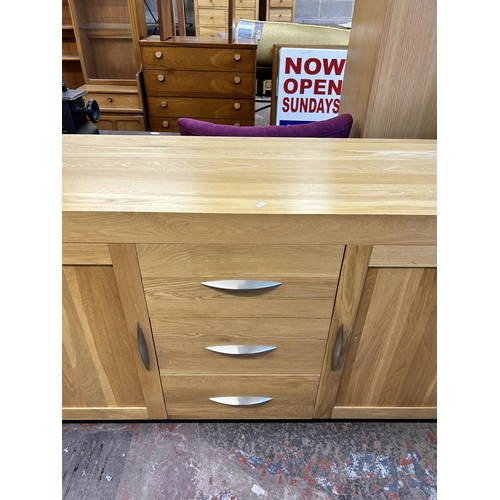 83 - A modern oak sideboard - approx. 86cm high x 160cm wide x 50cm deep