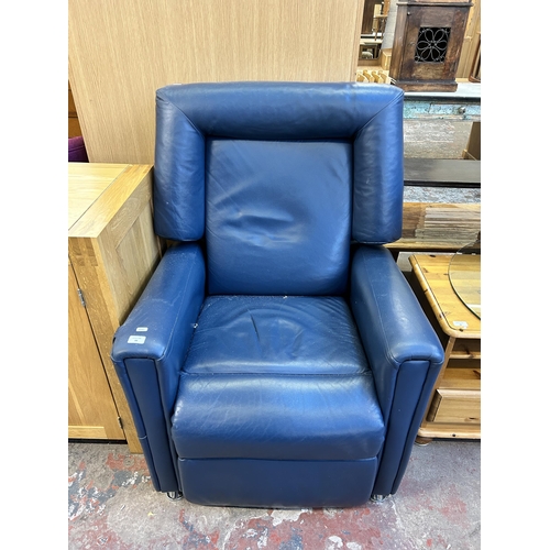 84 - A modern blue leather electric rise and recline armchair with remote control and power supply