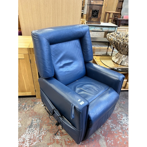 84 - A modern blue leather electric rise and recline armchair with remote control and power supply