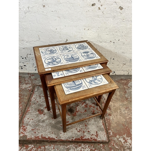 88 - A mid 20th century teak and tile top nest of tables