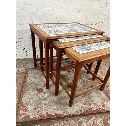 88 - A mid 20th century teak and tile top nest of tables