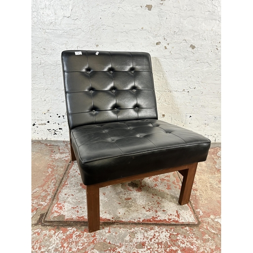 97 - A mid 20th century teak and black vinyl lounge chair