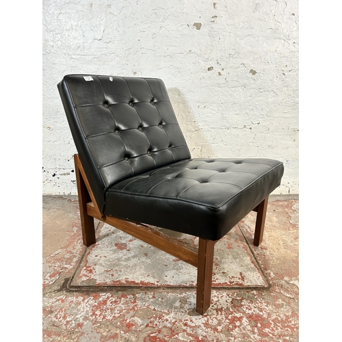 97 - A mid 20th century teak and black vinyl lounge chair