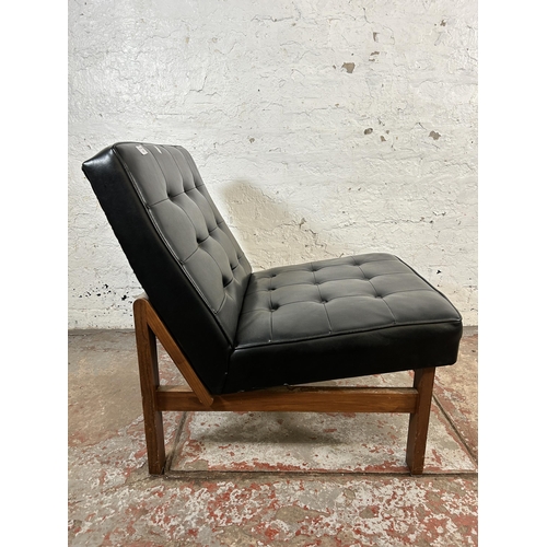 97 - A mid 20th century teak and black vinyl lounge chair