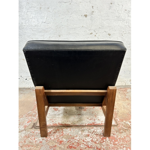 97 - A mid 20th century teak and black vinyl lounge chair