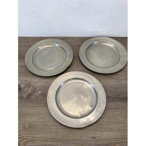 375 - A collection of antique and later metalware to include three 18th/19th century pewter dinner plates ... 