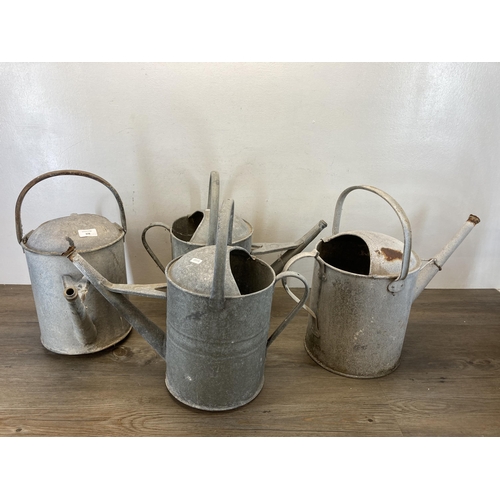 378 - Four vintage galvanized watering cans