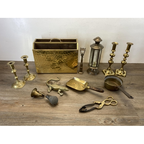 380 - A collection of vintage brass ware to include embossed two section magazine rack, candlesticks, 19th... 