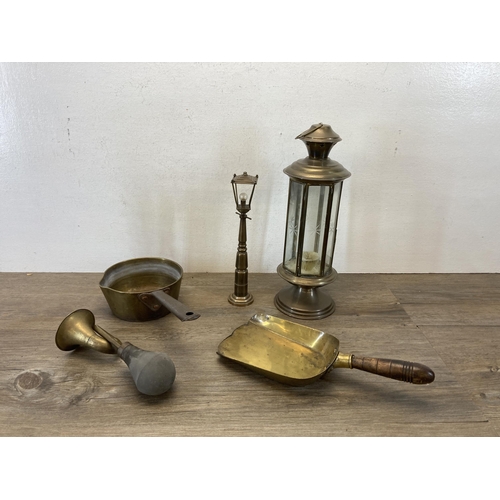 380 - A collection of vintage brass ware to include embossed two section magazine rack, candlesticks, 19th... 