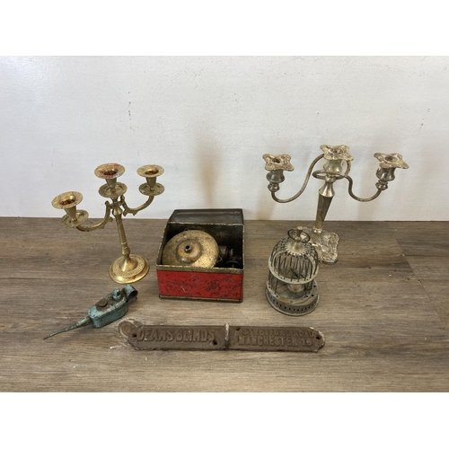 389 - A collection of metalware to include vintage brass three section candelabra, 19th century copper and... 