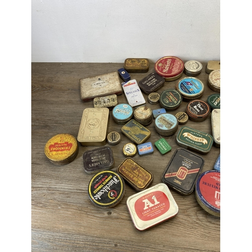 392 - A collection of vintage tins to include Craven 