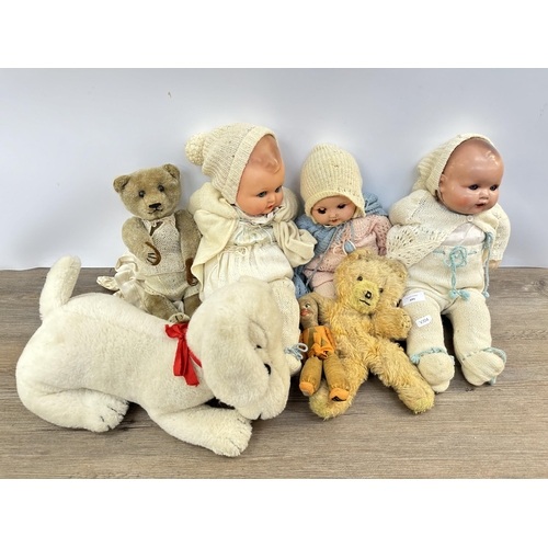 395 - A collection of vintage soft toys and dolls to include Armand Marseille plastic headed doll etc.