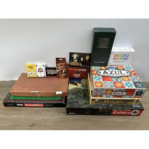 398 - A collection of board games to include Scrabble, Sushi Go Party!, Unstable Unicorns etc.