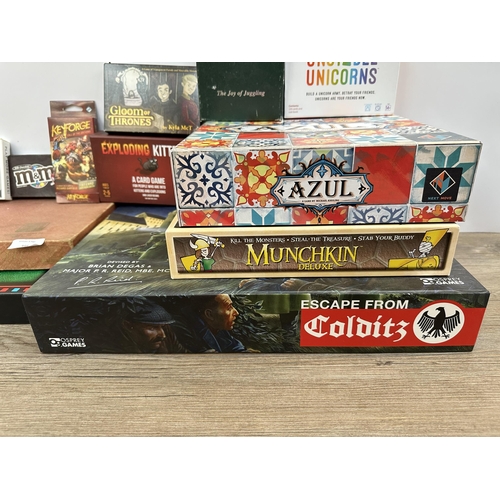 398 - A collection of board games to include Scrabble, Sushi Go Party!, Unstable Unicorns etc.