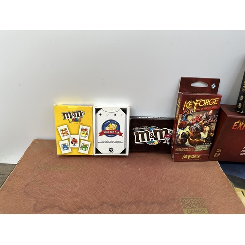 398 - A collection of board games to include Scrabble, Sushi Go Party!, Unstable Unicorns etc.